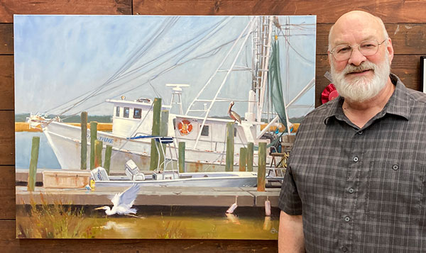 Artist Todd Baxter with his second place artwork.
