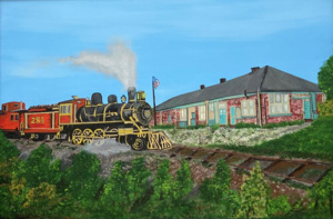 Train crossing through a small town intersection.