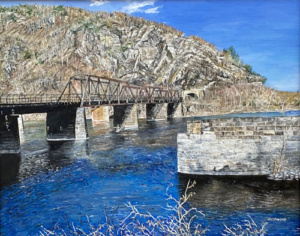 Walkers Ferry train bridge over blue waters.