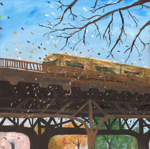 A train travelling on a overpass as leaves fall.