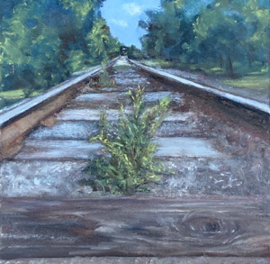 Drawing of a sprig of green plants growing from the gravel in the train tracks.
