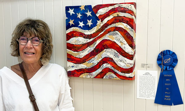 artist Phiddy Webb with her first place artwork.