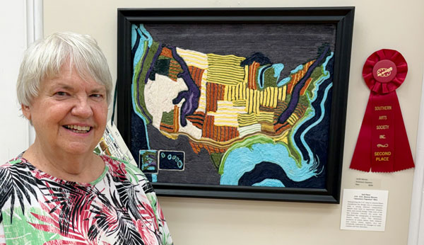artist Karen Warren with her second place artwork.