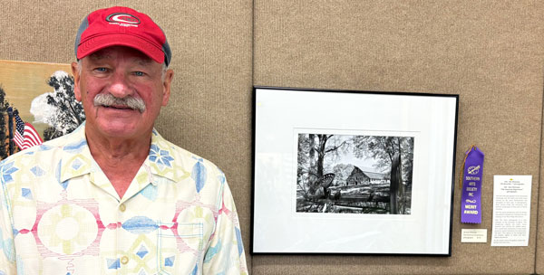 photographer Alex Pietersen with his merit award artwork.