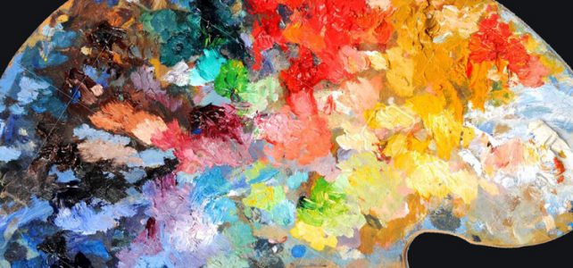 artist palette covered in layers of paint colors