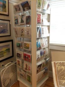 rotating display of greeting cards in southern arts society gift shop