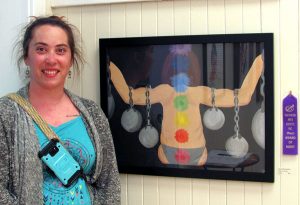 artist Jennifer Bowling in form of her merit award winning painting of weightlifting woman