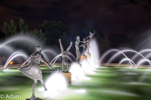 sculpture in a fountain night photography