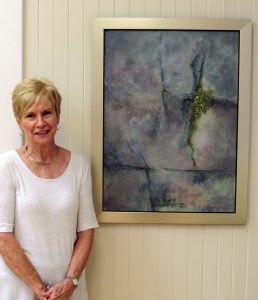 Susan Walker with her merit award acrylic painting