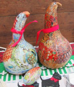 2 gourds decorated as birds in colored pencil