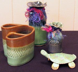 pottery sculpture of turtle and vases