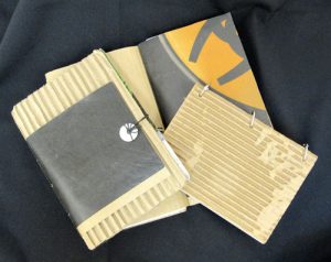 hand-made art book with gray and yellow paper and corrugated cardboard insert by Laura Gardner