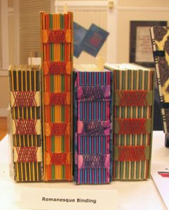 four multi-colored art books featuring romanesque binding