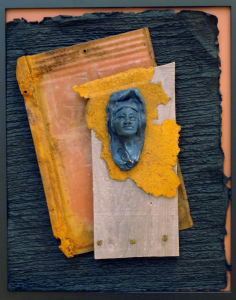 Paper sculpture with small carved bust of a woman by artist Janet L Kaufman